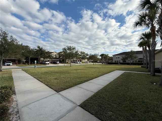 a view of a street with a cars park