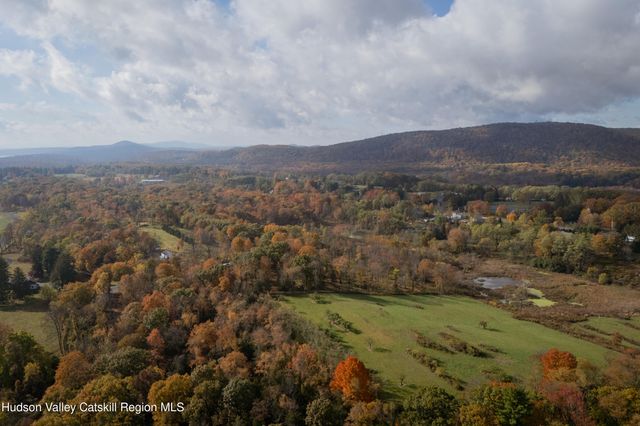 an aerial view of houses covered in trees