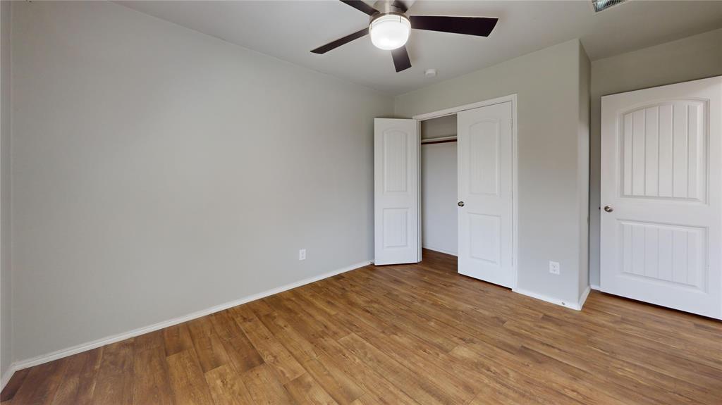3101 Buckthorn Street Forney, TX 75126 - Photo 26 of 40 Neutral tone walls complemented by wood-finish flooring