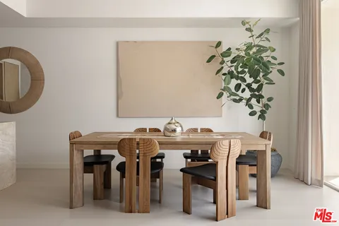 a view of a dining area with furniture and chandelier