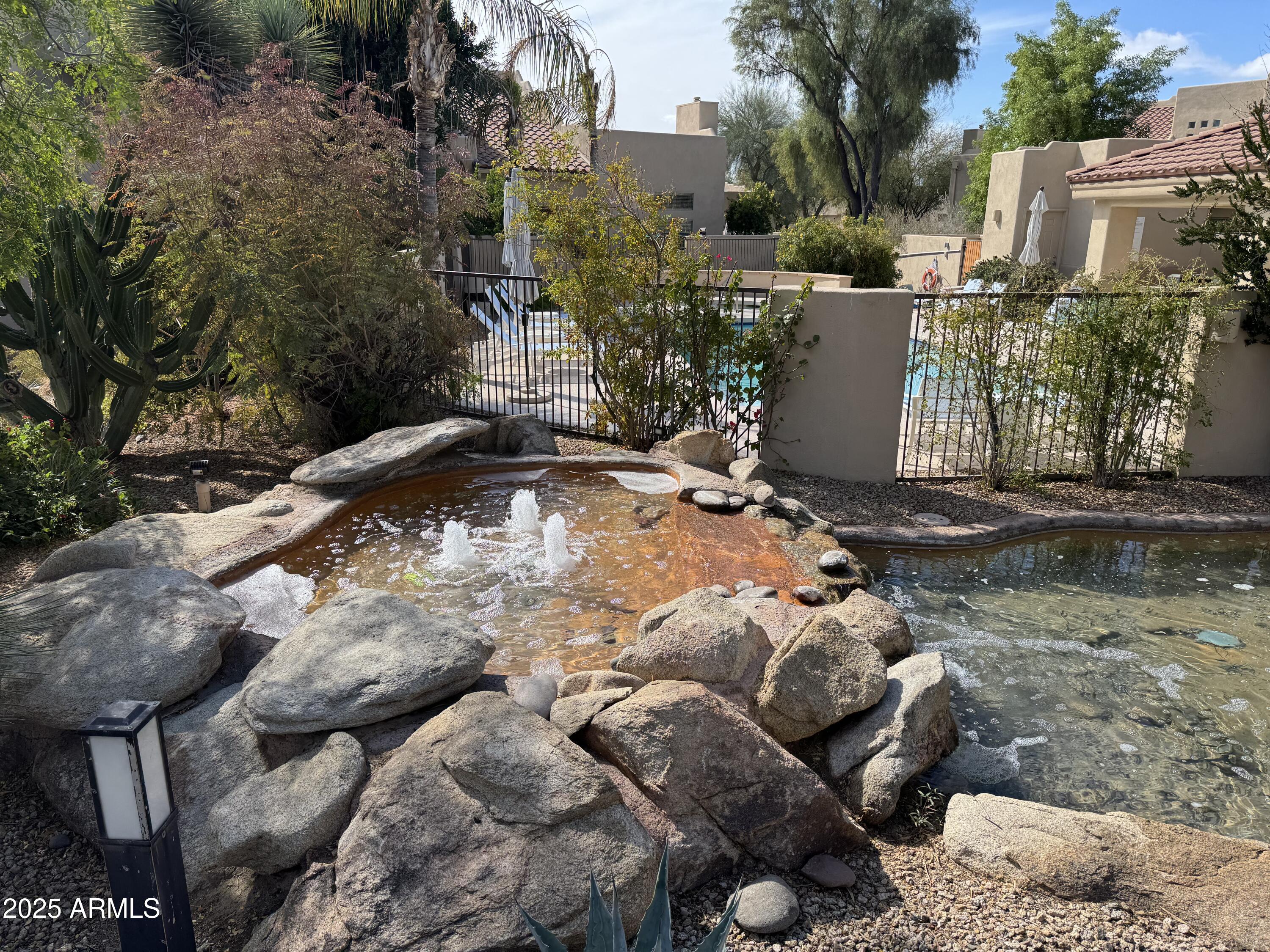9065 East Gary Road, Unit 124 Scottsdale, AZ 85260 - Photo 45 of 52 Waterscape by pool area