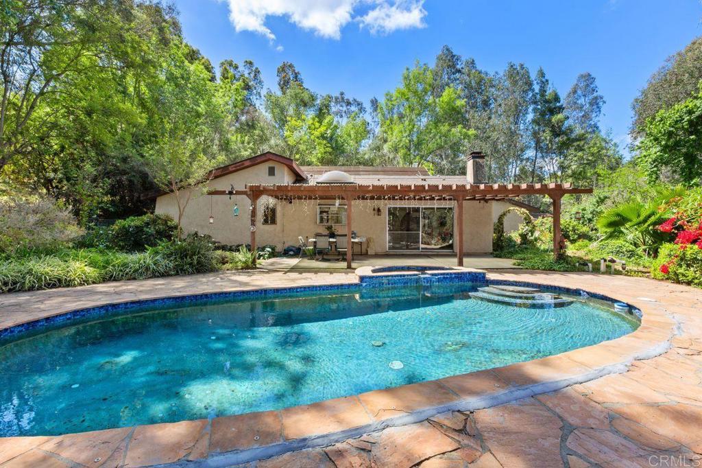 29560 Lilac Road Valley Center, CA 92082 - Photo 3 of 43 a view of a house with swimming pool and a yard