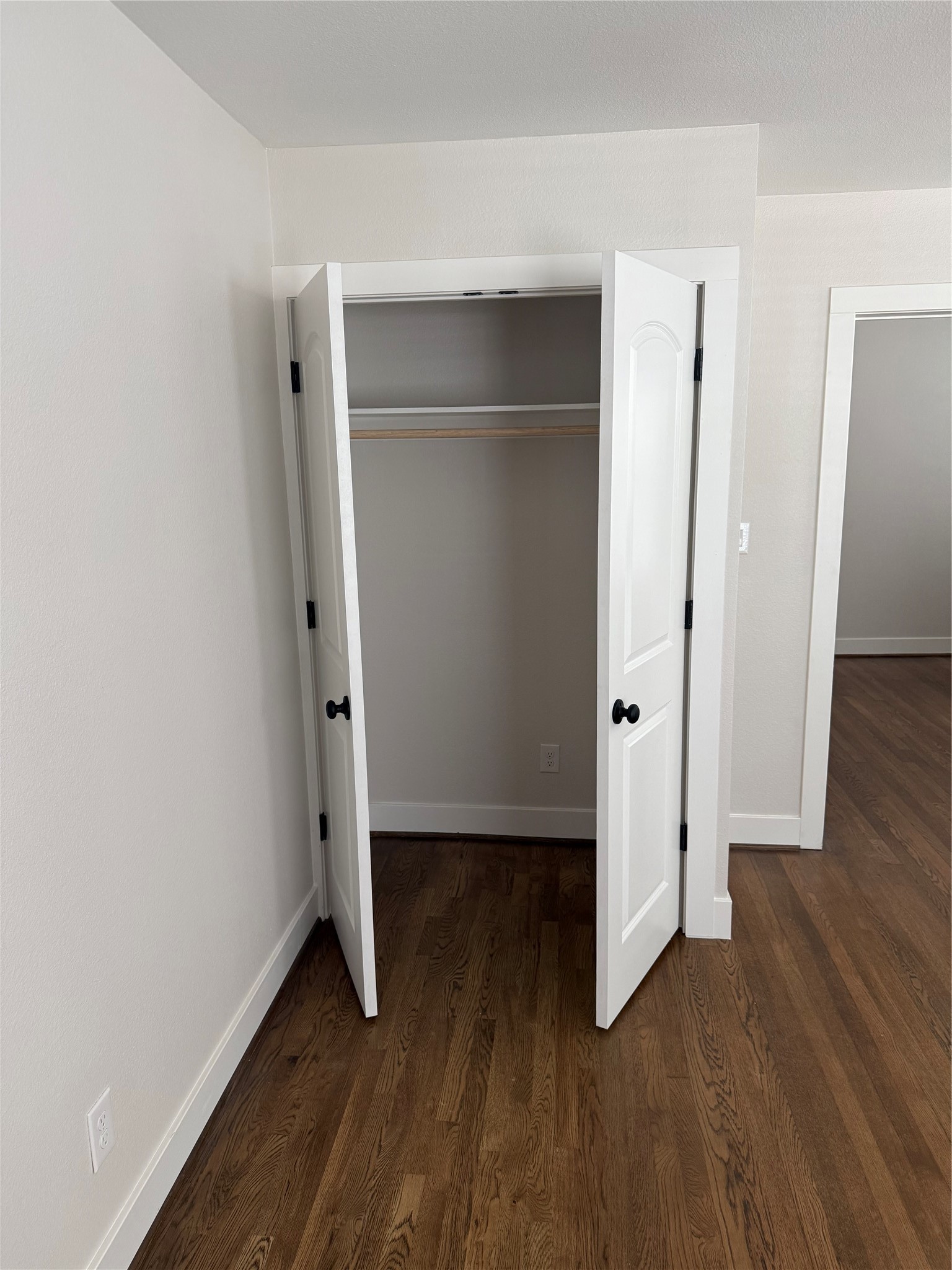 2001 Brun Street, Unit 1 Houston, TX 77019 - Photo 14 of 15 an empty room with wooden floor and closet