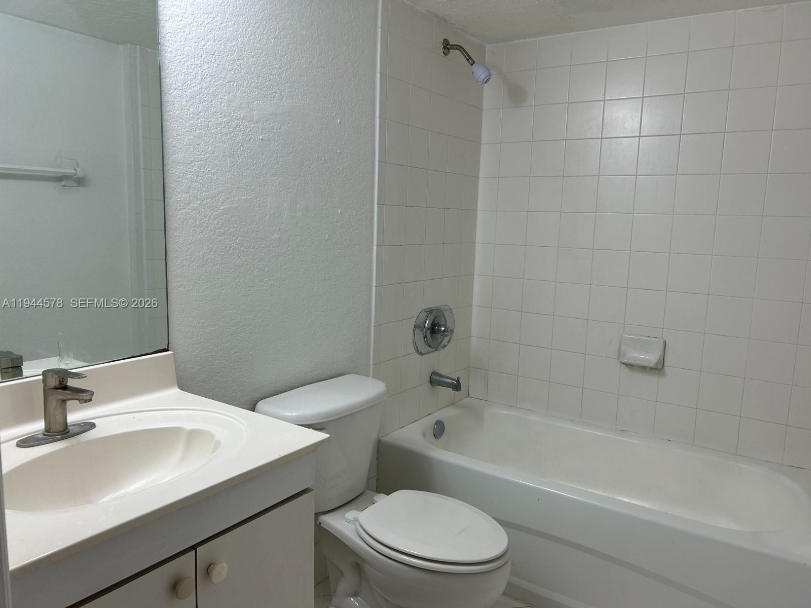 2921 Southeast 12th Road, Unit 10256 Homestead, FL 33035 - Photo 6 of 12 a bathroom with a sink toilet and shower