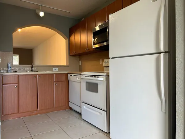a view of a kitchen with a sink