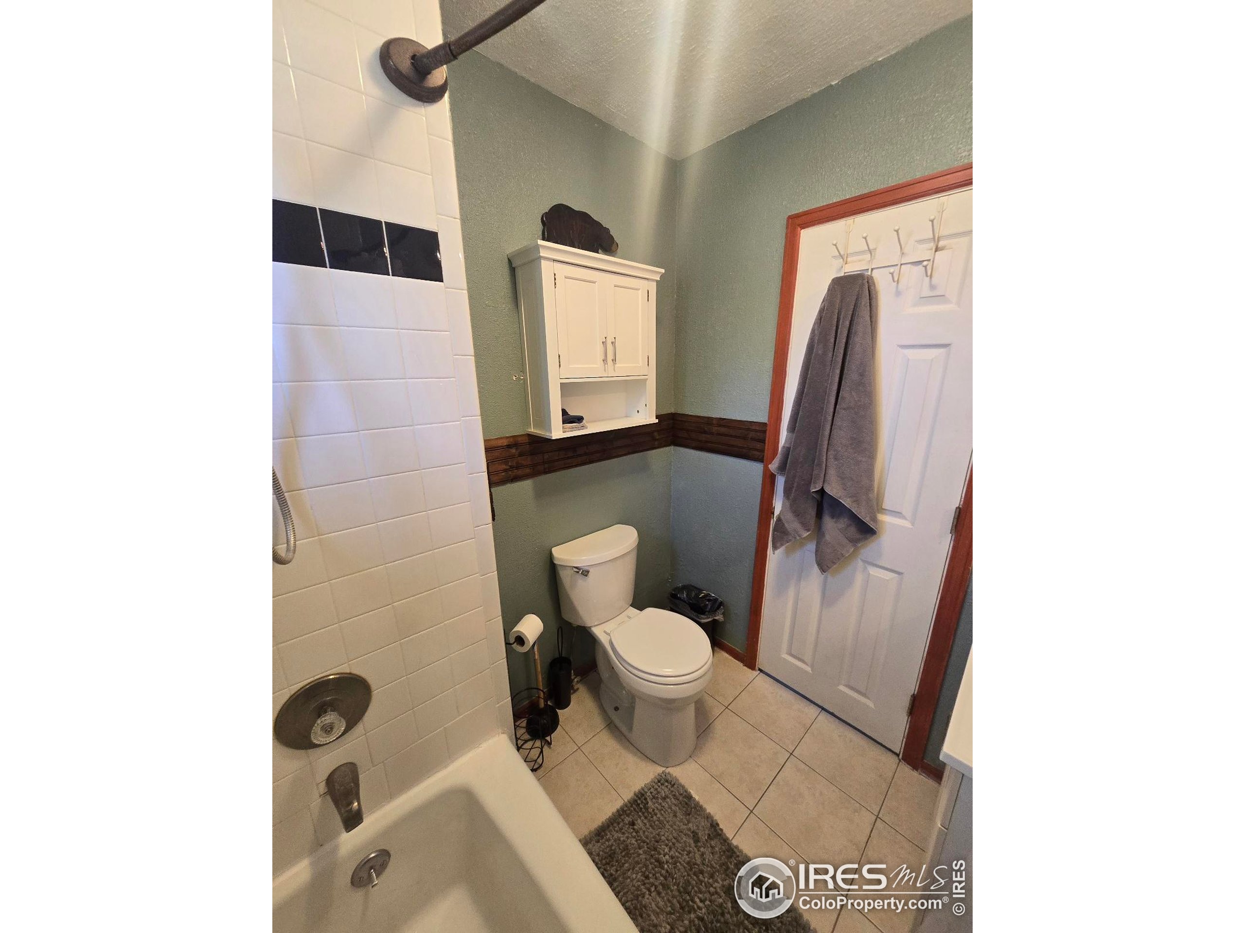 7926 County Road Wiggins, CO 80654 - Photo 20 of 27 a bathroom with a toilet and a shower
