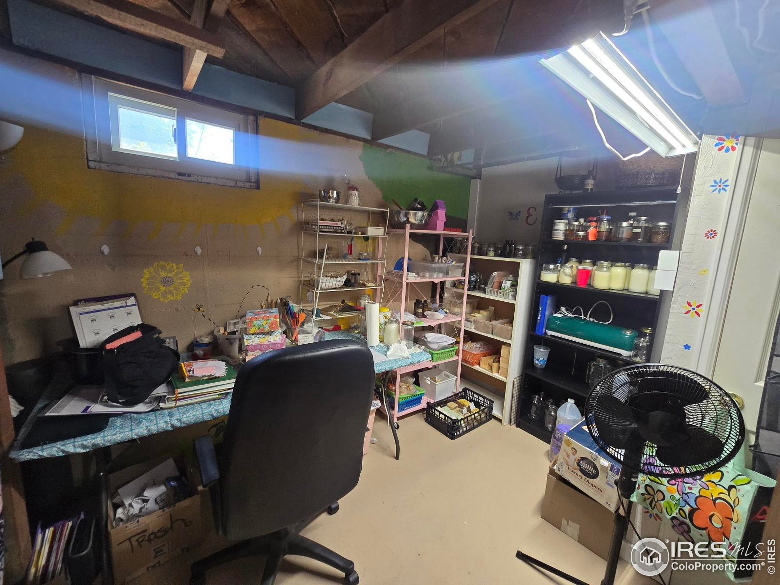 7926 County Road Wiggins, CO 80654 - Photo 23 of 27 a room with a wooden floor and musical instruments
