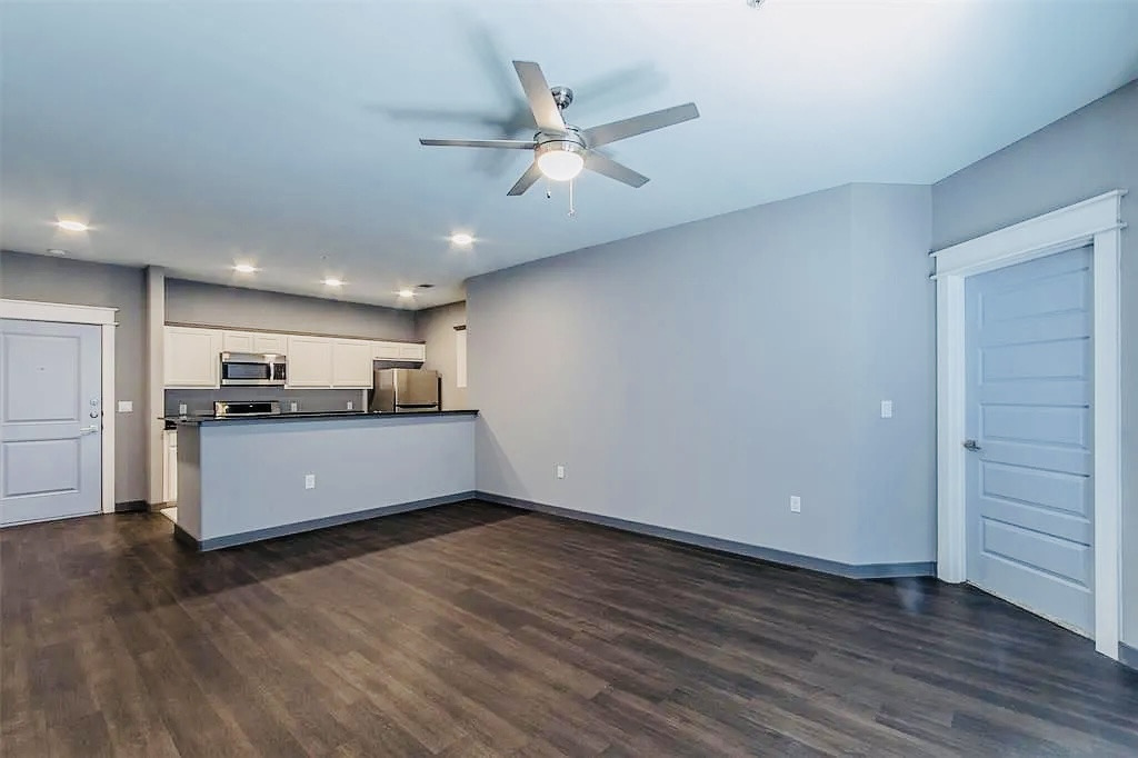 200 Maple Lane, Unit 1302 Elgin, TX 78621 - Photo 12 of 18 a view of a kitchen with a sink and a stove top oven