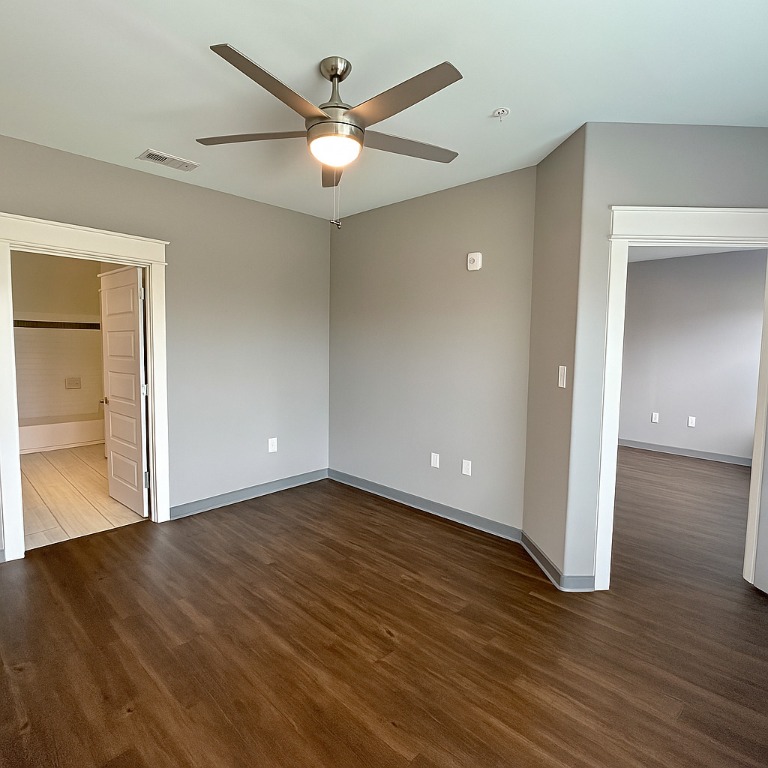 200 Maple Lane, Unit 1302 Elgin, TX 78621 - Photo 17 of 18 a view of an empty room with wooden floor