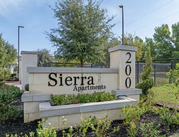 200 Maple Lane, Unit 1302 Elgin, TX 78621 - Photo 2 of 18 a sign on the side of a street