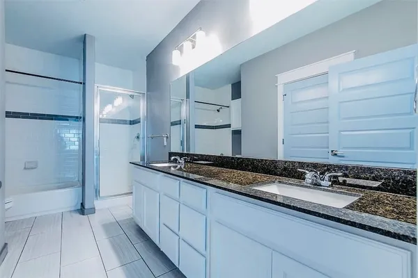 a kitchen with stainless steel appliances granite countertop cabinets and a stove top oven