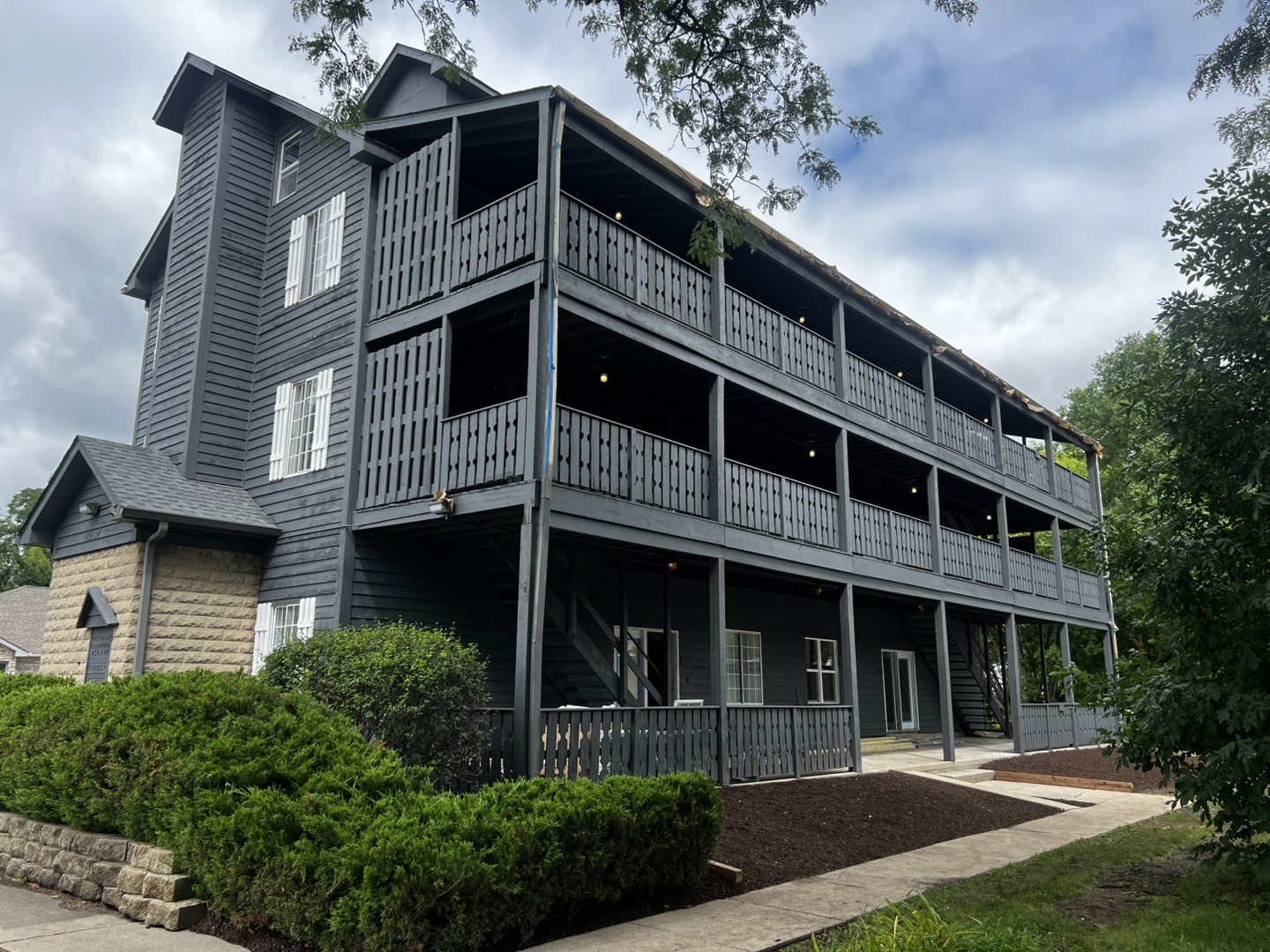 a front view of a house with a garden