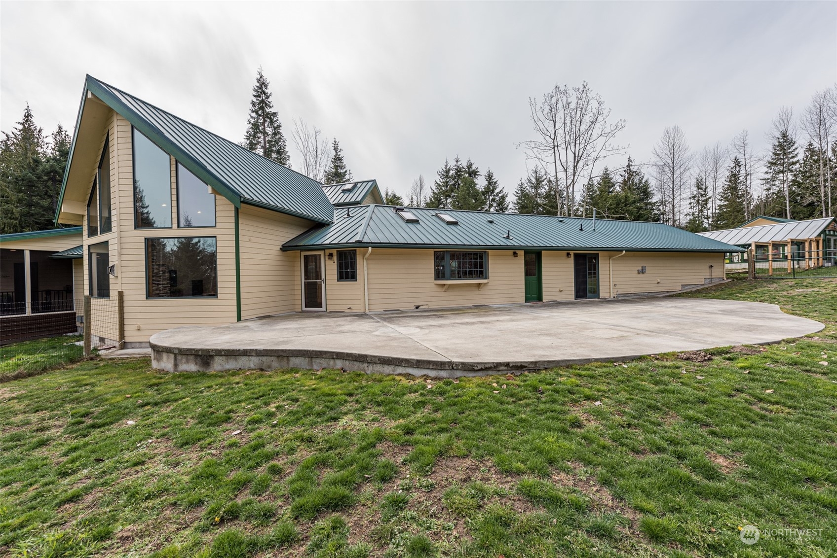 651 Senz Road Sequim, WA 98382 - Photo 5 of 40 a backyard of a house with table and chairs