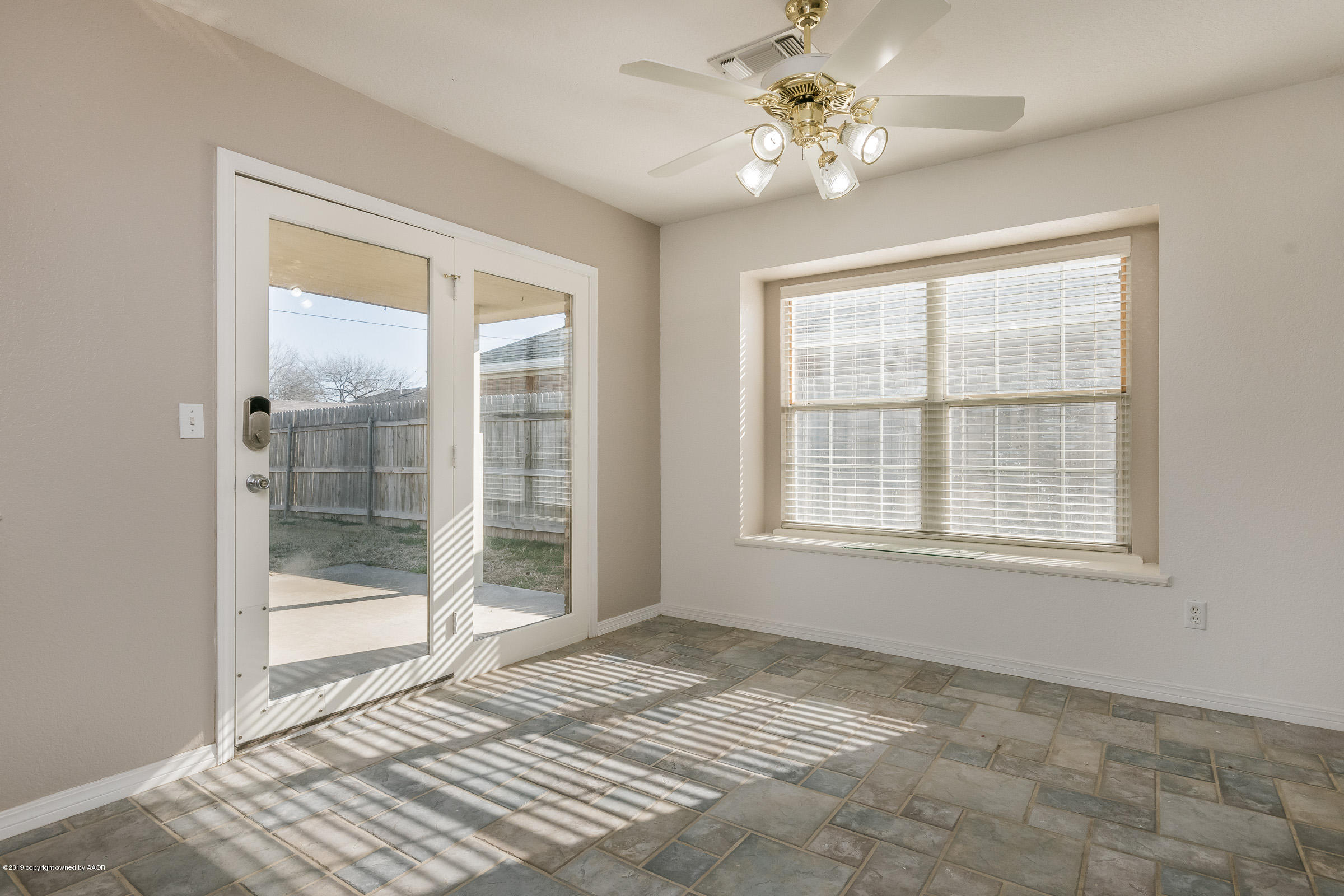 5404 Leo Lane Amarillo, TX 79110 - Photo 5 of 20 a view of an empty room with window and a kitchen