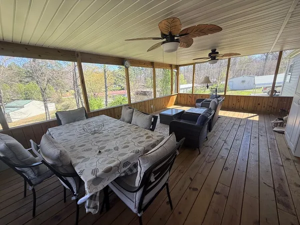 a view of a dining room with furniture window and outside view