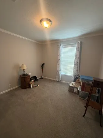 a room with gym equipment and a window