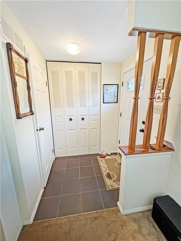 2303 Firethorn Road Bridgeville, PA 15017 - Photo 2 of 25 Foyer features a coat closet and a powder room.