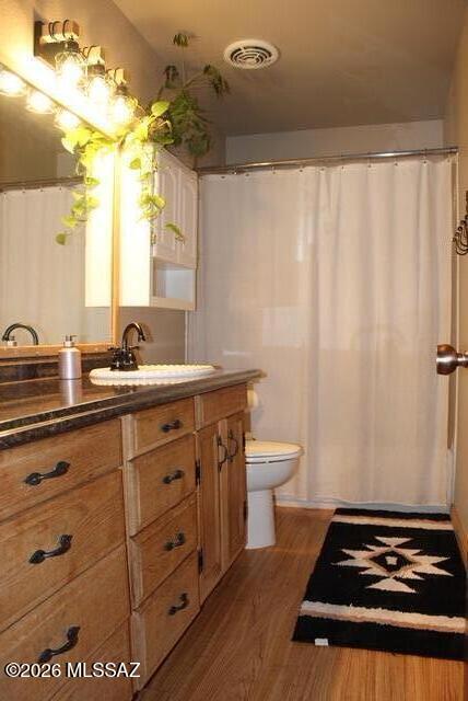 1201 East Old Stewart Road Willcox, AZ 85643 - Photo 27 of 49 a bathroom with a sink a toilet and a mirror