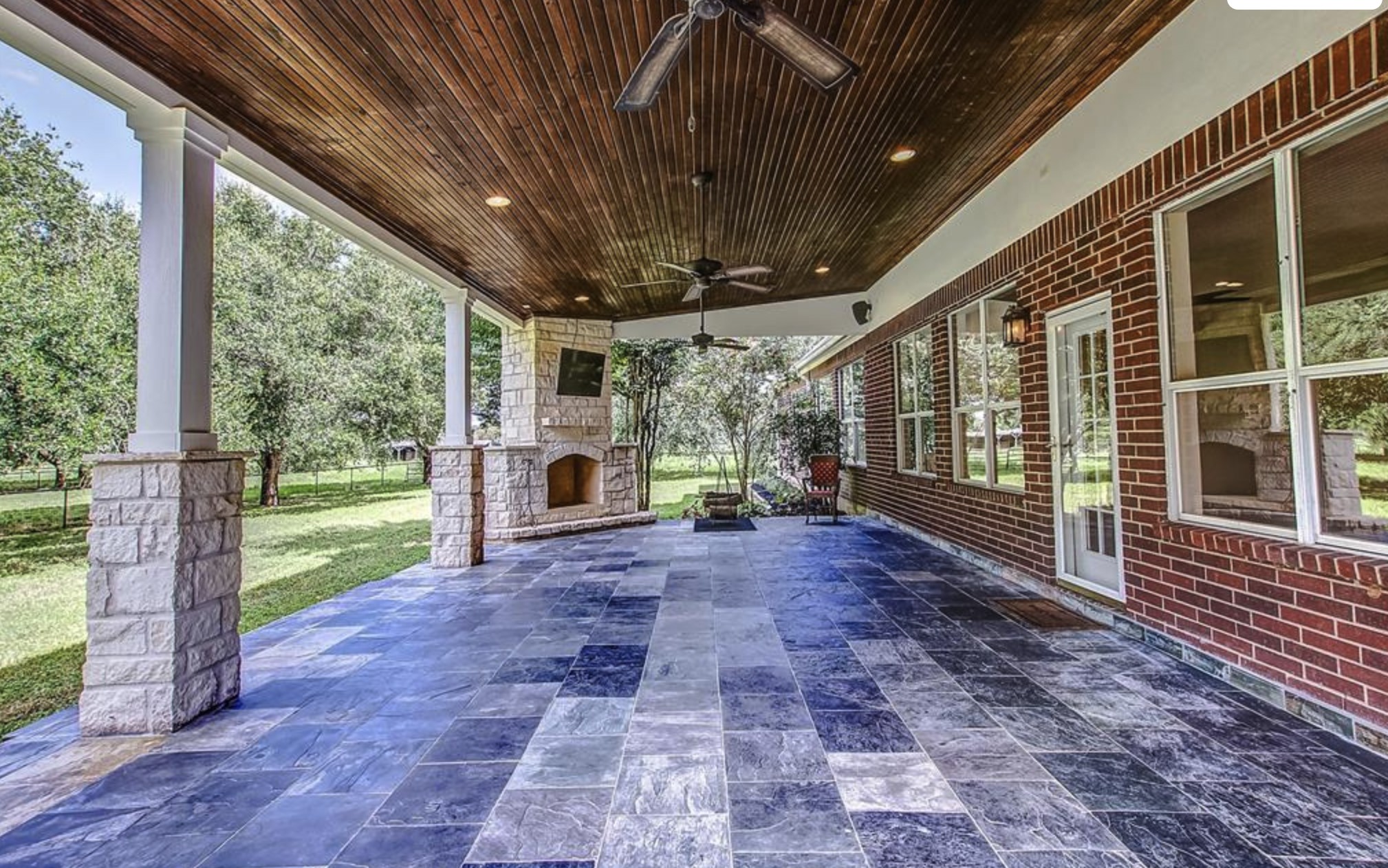 4309 Bowser Road Fulshear, TX 77441 - Photo 16 of 21 a view of a porch with furniture and garden