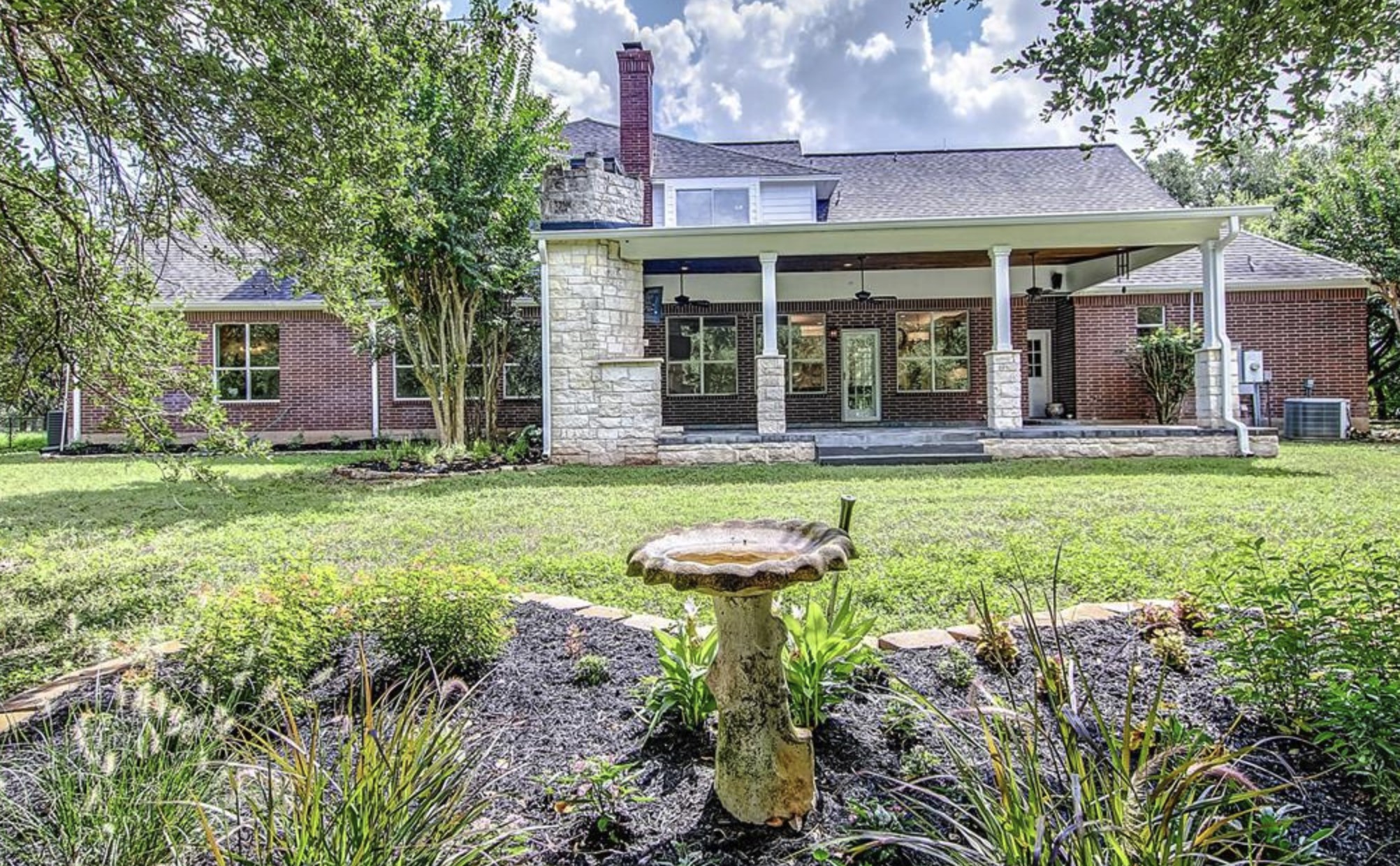 4309 Bowser Road Fulshear, TX 77441 - Photo 17 of 21 front view of a brick house with a yard