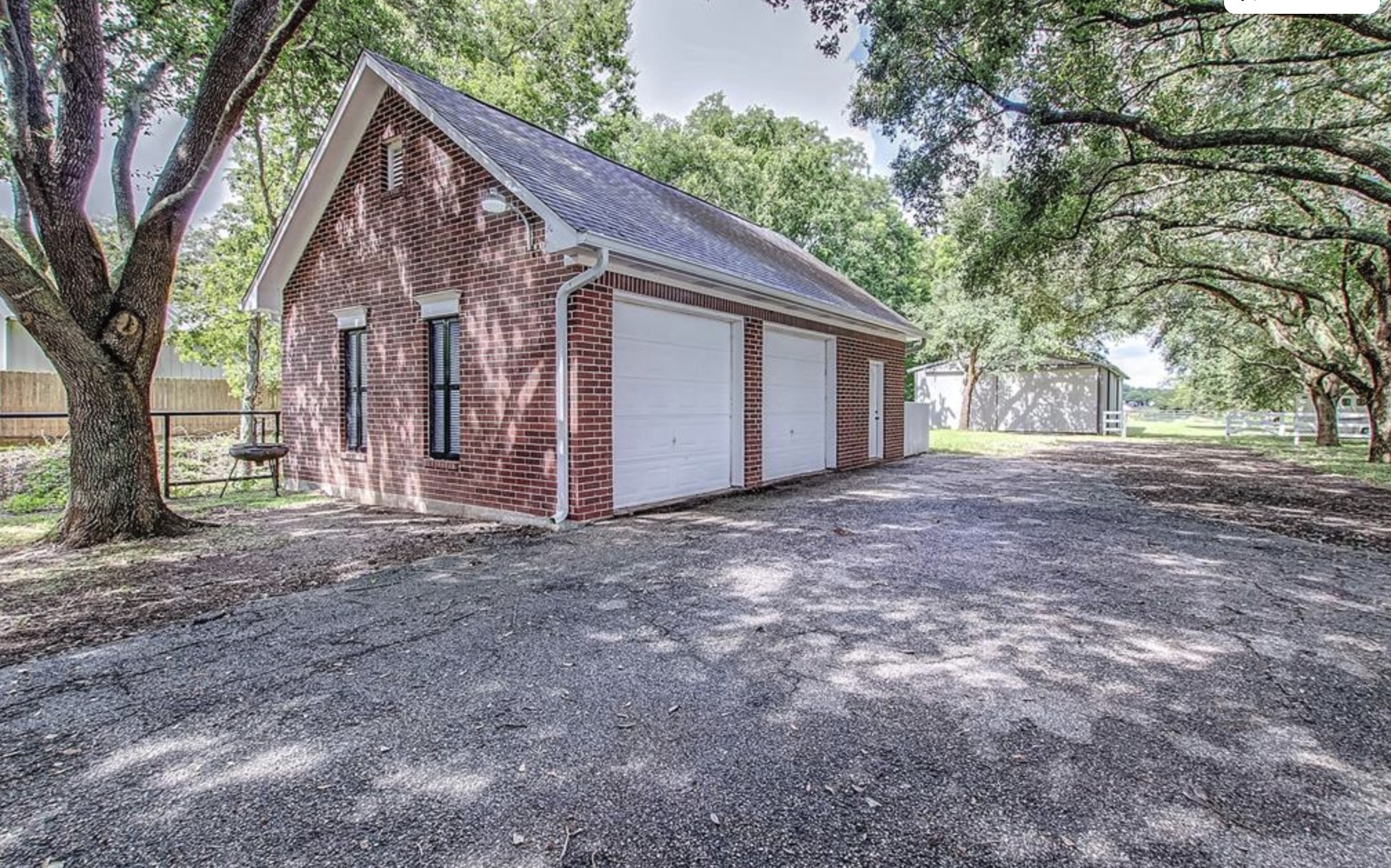 4309 Bowser Road Fulshear, TX 77441 - Photo 18 of 21 a view of a house with a large tree and a tree