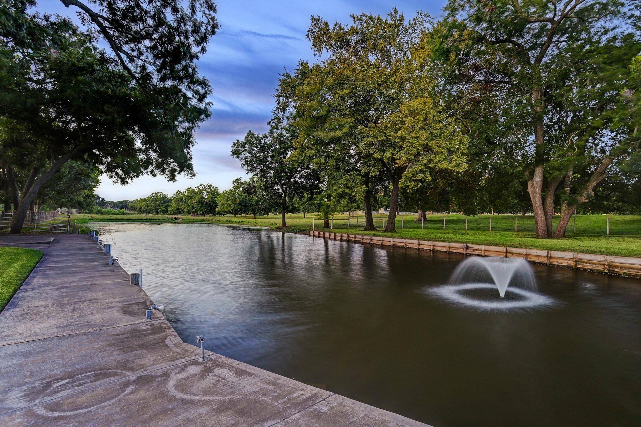 4309 Bowser Road Fulshear, TX 77441 - Photo 5 of 21 a view of a lake with a yard