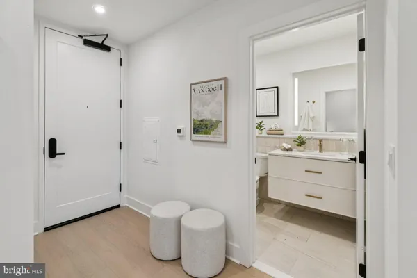 a bathroom with a toilet sink and shower