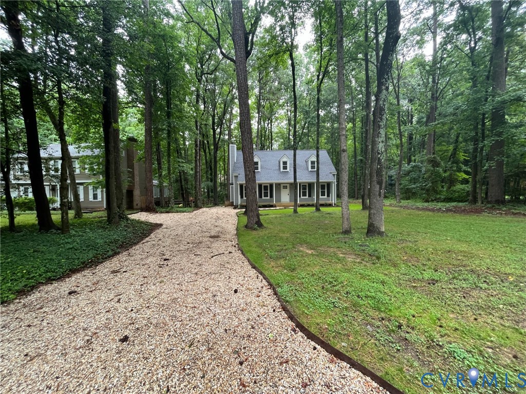 13912 Sterlings Bridge Road Midlothian, VA 23112 - Photo 3 of 47 Gravel driveway with a wood border, leading to a r