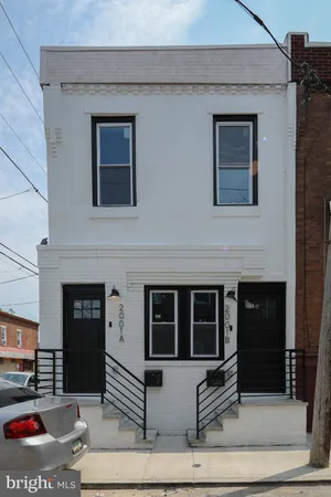 a view of front door of house with stairs