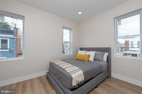 a bedroom with a bed and window