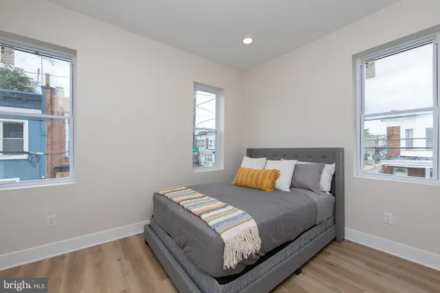 a bedroom with a bed and window