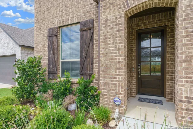 a front view of a house with a glass door