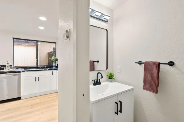 a bathroom with a sink and a mirror