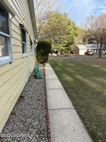 a view of a pathway with a yard