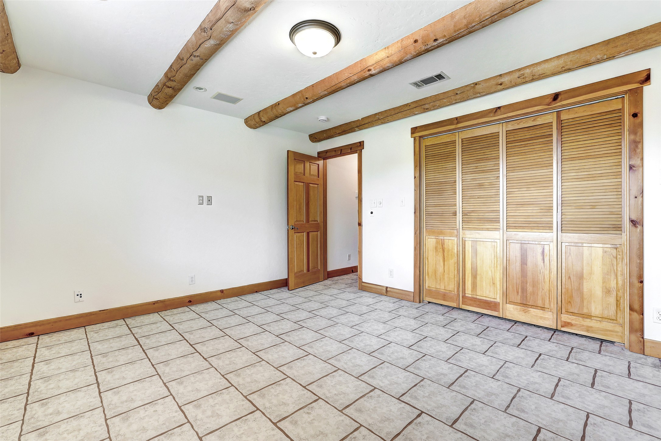125 Kyle Lane Georgetown, TX 78633 - Photo 26 of 34 Unfurnished bedroom featuring a closet and beamed ceiling