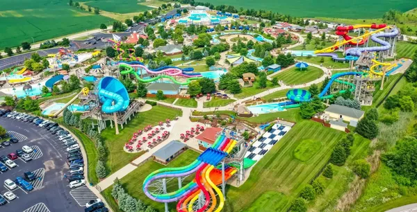 a view of a swimming pool with a yard