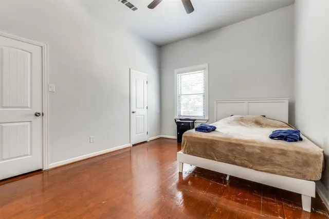 a bedroom with a bed and window