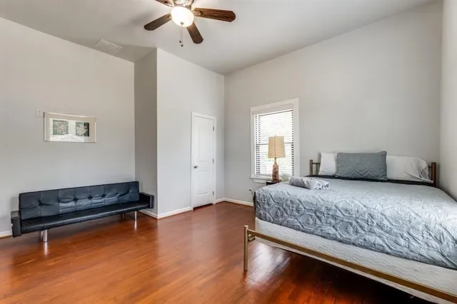 a bedroom with bed and window