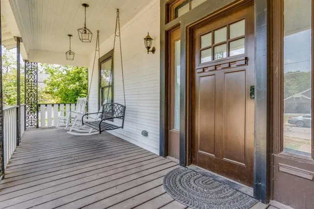 a view of a room with wooden floor and chair