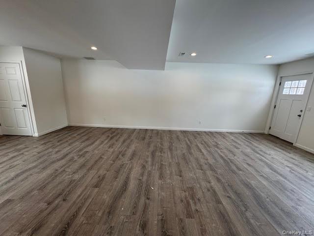 11 Alexandra Matthews Road, Unit B Wallkill, NY 12589 - Photo 11 of 41 an empty room with wooden floor and windows