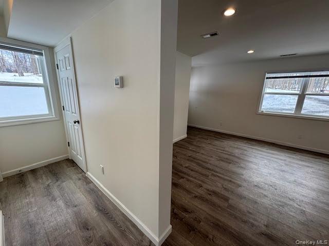 11 Alexandra Matthews Road, Unit B Wallkill, NY 12589 - Photo 12 of 41 an empty room with wooden floor and windows
