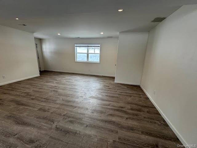 11 Alexandra Matthews Road, Unit B Wallkill, NY 12589 - Photo 15 of 41 an empty room with wooden floor and windows