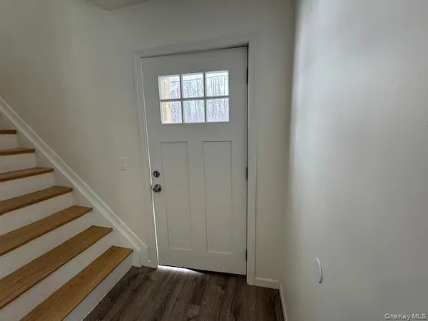 a view of entryway with wooden floor