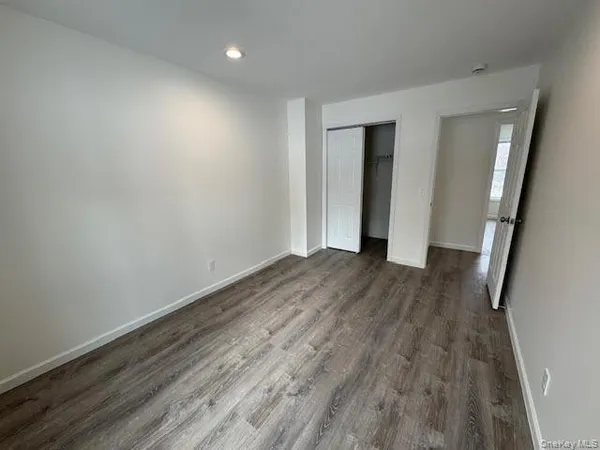 a view of a room with wooden floor and stairs