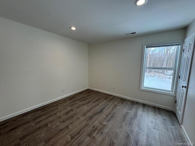 11 Alexandra Matthews Road, Unit B Wallkill, NY 12589 - Photo 24 of 41 wooden floor in an empty room with a window