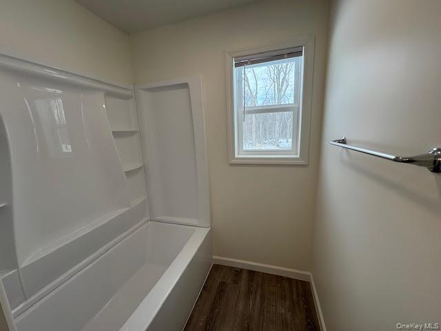 11 Alexandra Matthews Road, Unit B Wallkill, NY 12589 - Photo 26 of 41 a bathroom with a tub shower and sink