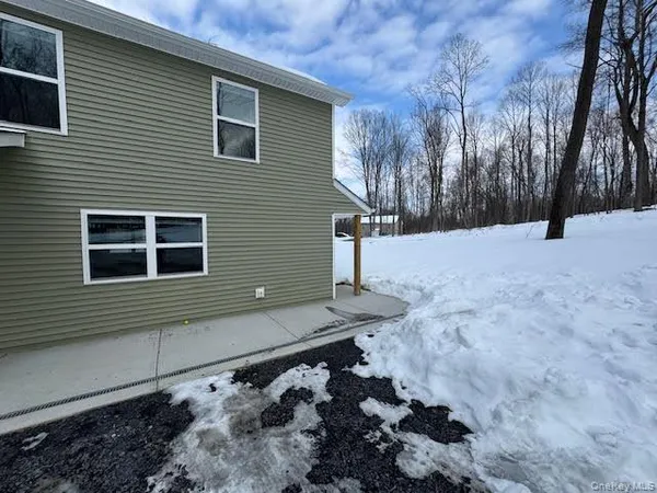 a view of a yard covered in snow