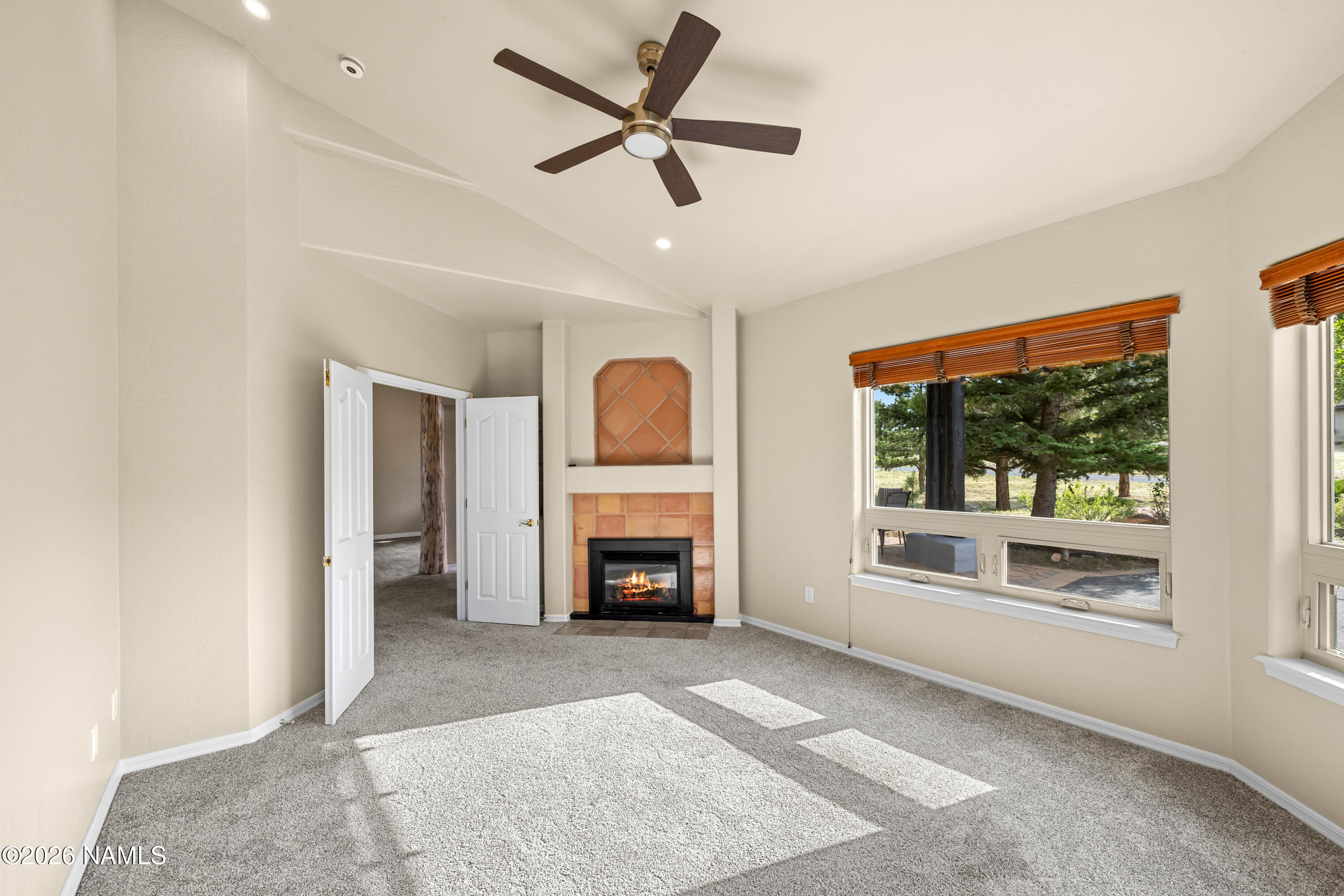 8205 North Reata Road Flagstaff, AZ 86004 - Photo 15 of 45 Primary bedroom with fireplace!
