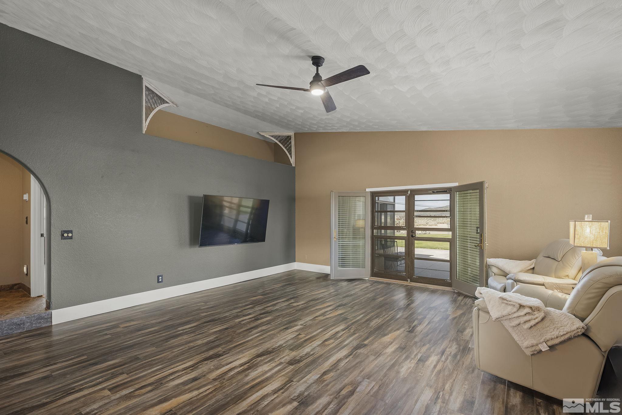 10890 Osage Road Reno, NV 89508 - Photo 13 of 40 a view of livingroom with hardwood floor and a ceiling fan