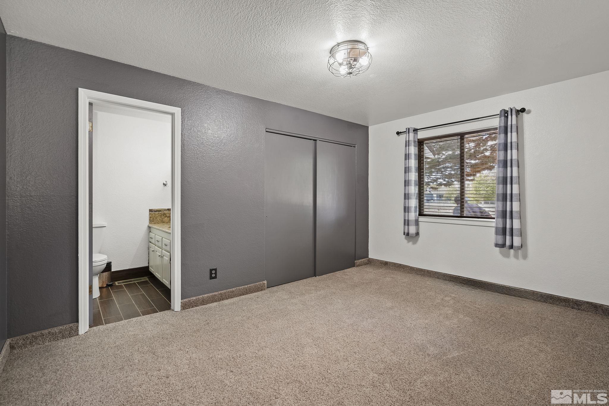 10890 Osage Road Reno, NV 89508 - Photo 19 of 40 a view of an empty room with a window
